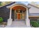 Inviting front entrance featuring a unique portico, stone accents, and modern lighting at 4070 Whitewater Creek Nw Rd, Atlanta, GA 30327