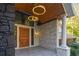 Close-up of the entryway showcases stylish pillars and a unique lighting fixture at 4070 Whitewater Creek Nw Rd, Atlanta, GA 30327