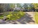 Expansive home with mature trees, long driveway, and manicured lawn at 4070 Whitewater Creek Nw Rd, Atlanta, GA 30327