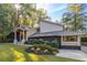 Stunning home featuring manicured lawn, stone accents, and lush landscaping for great curb appeal at 4070 Whitewater Creek Nw Rd, Atlanta, GA 30327