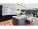 Modern kitchen with granite countertops, stainless steel appliances, island and access to outdoor patio at 4070 Whitewater Creek Nw Rd, Atlanta, GA 30327