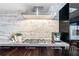 The kitchen features sleek countertops, stainless-steel appliances, and elegant detailing, creating a modern cooking experience at 4070 Whitewater Creek Nw Rd, Atlanta, GA 30327