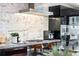 Modern kitchen featuring stainless appliances, gas range, and sleek black cabinetry at 4070 Whitewater Creek Nw Rd, Atlanta, GA 30327