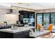 Spacious kitchen with marble countertops, stainless appliances, and dining area with backyard access at 4070 Whitewater Creek Nw Rd, Atlanta, GA 30327
