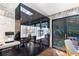 Kitchen featuring built-in stainless steel appliances, sleek black cabinetry, and access to the outdoor living space at 4070 Whitewater Creek Nw Rd, Atlanta, GA 30327