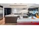 Open-concept kitchen with marble counters, large island with banquette, and stainless steel appliances at 4070 Whitewater Creek Nw Rd, Atlanta, GA 30327
