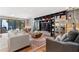 Well-designed living room featuring a large built-in bookcase and access to the outdoor patio at 4070 Whitewater Creek Nw Rd, Atlanta, GA 30327