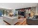 Spacious living room with built-in bookshelves, comfortable seating, and access to the backyard at 4070 Whitewater Creek Nw Rd, Atlanta, GA 30327