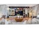 Cozy living room with built-in bookshelves, a comfortable seating area, and a stylish rug at 4070 Whitewater Creek Nw Rd, Atlanta, GA 30327