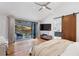 Bright main bedroom with hardwood floors, sliding doors to the patio, and a convenient barn door to the en-suite bath at 4070 Whitewater Creek Nw Rd, Atlanta, GA 30327