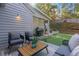 Cozy patio with seating area, outdoor grill, and lush landscaping at 4070 Whitewater Creek Nw Rd, Atlanta, GA 30327