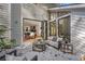 Backyard patio with outdoor seating visible through large, open glass doors to the dining room at 4070 Whitewater Creek Nw Rd, Atlanta, GA 30327