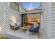 Cozy patio with seating area and glass doors opening to a bedroom with hardwood floors at 4070 Whitewater Creek Nw Rd, Atlanta, GA 30327