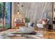 Cozy sitting area with modern chairs, a decorative cowhide rug, and floor-to-ceiling windows at 4070 Whitewater Creek Nw Rd, Atlanta, GA 30327