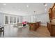 Entertainment space features a bar with seating, a refrigerator and a glass paneled door out to a patio at 5021 Heatherwood Ct, Roswell, GA 30075