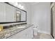 Bathroom features a granite countertop, white cabinets, and tiled shower with glass door at 5021 Heatherwood Ct, Roswell, GA 30075