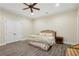 Bedroom with hardwood floors, ceiling fan and lights, and a closet with double doors at 5021 Heatherwood Ct, Roswell, GA 30075