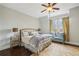 Bedroom with a large bed, window bench, side tables, and a plush rug at 5021 Heatherwood Ct, Roswell, GA 30075