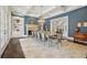 Spacious dining room with fireplace, chandelier, and custom built-ins, perfect for entertaining at 5021 Heatherwood Ct, Roswell, GA 30075