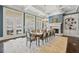 Formal dining room with fireplace, chandelier, French doors, and seating for ten at 5021 Heatherwood Ct, Roswell, GA 30075