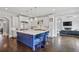 Open-concept kitchen with large island, bar seating, and stainless steel appliances perfect for entertaining at 5021 Heatherwood Ct, Roswell, GA 30075