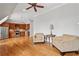 Living area has hardwood floors, a ceiling fan and is open to the eat-in kitchen at 5021 Heatherwood Ct, Roswell, GA 30075