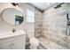 Clean bathroom with modern vanity and a walk-in shower at 1565 Ocala Sw Ave, Atlanta, GA 30311