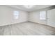 Bright and airy bedroom with neutral walls and hardwood floors at 1565 Ocala Sw Ave, Atlanta, GA 30311