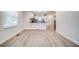 Bright dining area with wood-look floors and kitchen access at 1565 Ocala Sw Ave, Atlanta, GA 30311