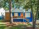 Charming blue house with white trim, wood accents and a landscaped yard at 1565 Ocala Sw Ave, Atlanta, GA 30311