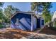Side view of blue house with pine straw landscaping at 1565 Ocala Sw Ave, Atlanta, GA 30311