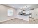 Modern kitchen with white cabinets, new appliances, and wood floors at 1565 Ocala Sw Ave, Atlanta, GA 30311