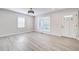 Bright living room featuring hardwood floors and large windows at 1565 Ocala Sw Ave, Atlanta, GA 30311