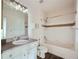 Cozy bathroom with a tub and shower, and a vanity with ample cabinet space at 4333 Dunwoody Park Dr # 3406, Dunwoody, GA 30338