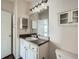 The bathroom features a vanity with cabinet space, and a large mirror with light fixture at 4333 Dunwoody Park Dr # 3406, Dunwoody, GA 30338