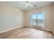 Bright bedroom features a modern ceiling fan, natural light, and wood-look laminate flooring at 4333 Dunwoody Park Dr # 3406, Dunwoody, GA 30338
