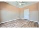 Bedroom with two-tone paint, ceiling fan, and stylish flooring at 4333 Dunwoody Park Dr # 3406, Dunwoody, GA 30338