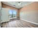 Bedroom featuring a window view, ceiling fan, and plank flooring at 4333 Dunwoody Park Dr # 3406, Dunwoody, GA 30338