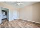 Bedroom with modern ceiling fan and wood-look laminate flooring features an ensuite bathroom at 4333 Dunwoody Park Dr # 3406, Dunwoody, GA 30338