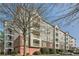 Exterior view of multilevel condo building with brick facade accents and multiple outdoor balconies at 4333 Dunwoody Park Dr # 3406, Dunwoody, GA 30338
