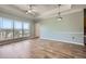 Spacious living room features tray ceiling, modern ceiling fan, and large window with treetop views at 4333 Dunwoody Park Dr # 3406, Dunwoody, GA 30338