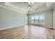 Spacious living room with hardwood floors, ceiling fan, and natural light from the large window at 4333 Dunwoody Park Dr # 3406, Dunwoody, GA 30338