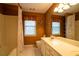 Bathroom features a tub/shower combination and a vanity with storage space at 100 Cottonwood Pl, Stockbridge, GA 30281