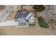 Aerial view of home with manicured lawn, dark roof, and fenced backyard at 100 Cottonwood Pl, Stockbridge, GA 30281