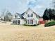 Charming two-story home with classic architecture and well-manicured landscaping at 100 Cottonwood Pl, Stockbridge, GA 30281