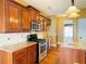 Kitchen with stainless steel appliances, granite counters, and classic wood cabinetry at 100 Cottonwood Pl, Stockbridge, GA 30281