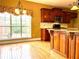 Kitchen with cherry cabinets, hardwood floors, granite countertops, and stainless steel appliances at 100 Cottonwood Pl, Stockbridge, GA 30281