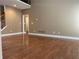 Spacious living room with hardwood floors and neutral walls at 100 Cottonwood Pl, Stockbridge, GA 30281