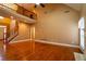 Bright living room with hardwood floors, fireplace, and staircase leading to the second story at 100 Cottonwood Pl, Stockbridge, GA 30281