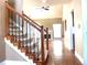 Staircase with wrought iron spindles and views into the living room at 100 Cottonwood Pl, Stockbridge, GA 30281